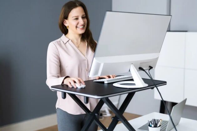 Learn how standing desks can relieve back pain in WFH.  – Learn how a standing desk can relieve back pain.